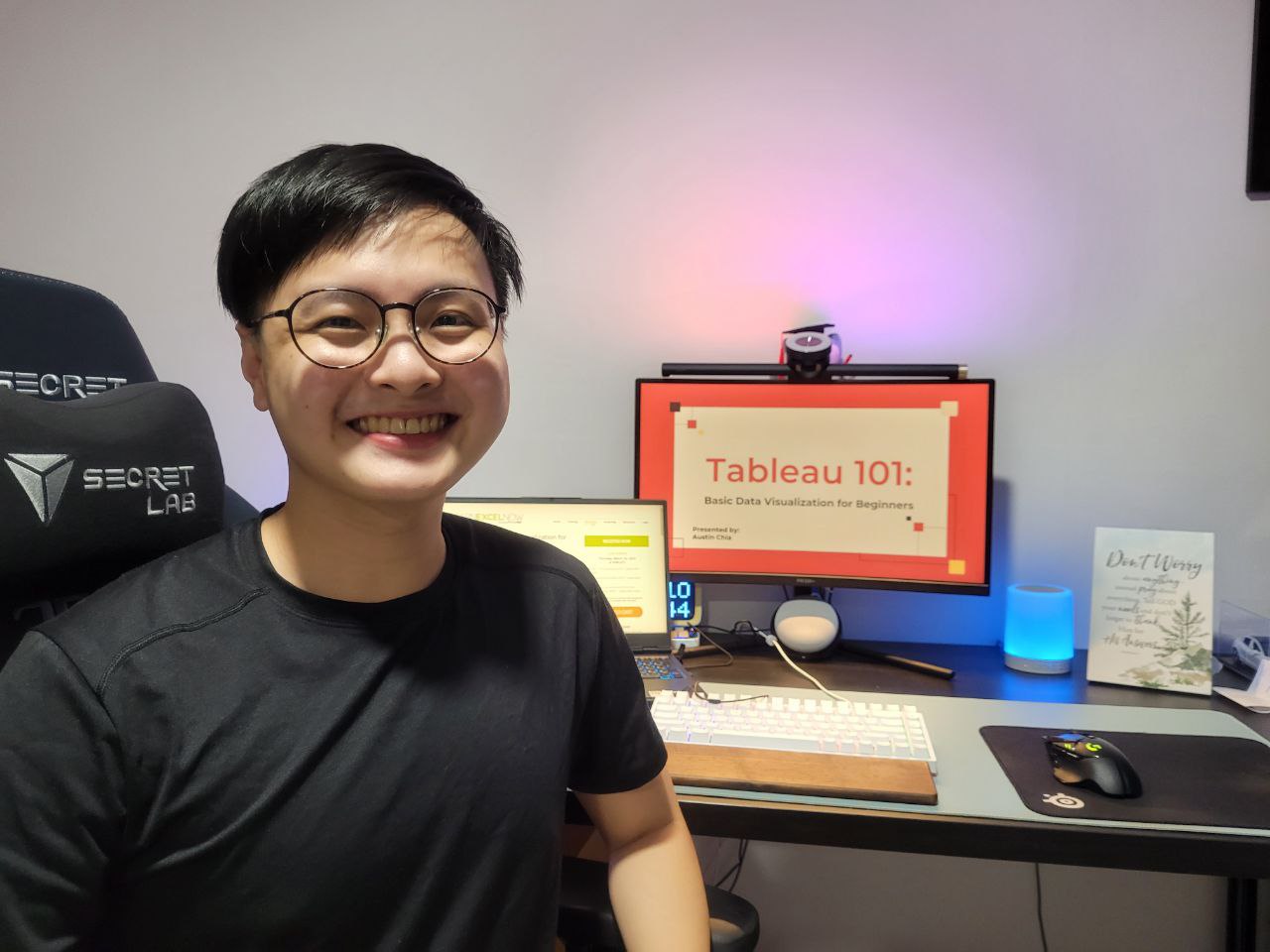Austin in front of a computer with the presentation titled Tableau 101