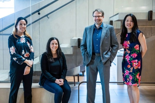Four team members of Unity Health Toronto, three women and one man.