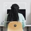 woman sitting at computer at home with computer terminal framing her